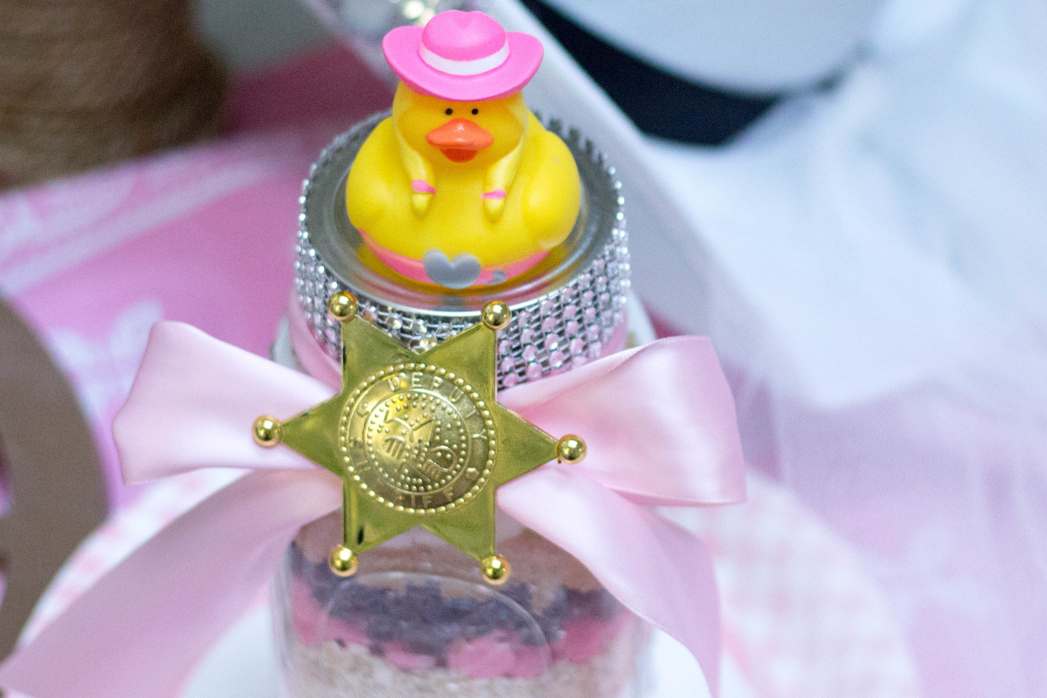 cowgirl cookies in mason jars decorated for country western shower