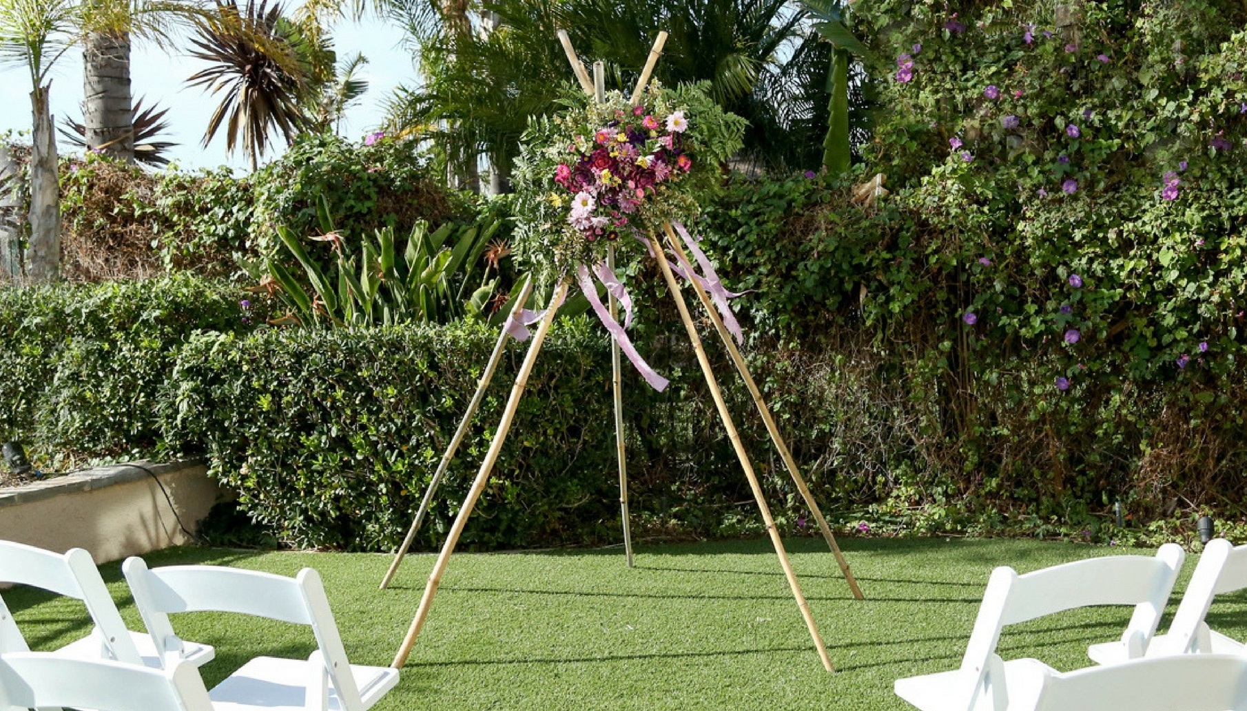 wedding teepee for ceremony with succulent floral accent