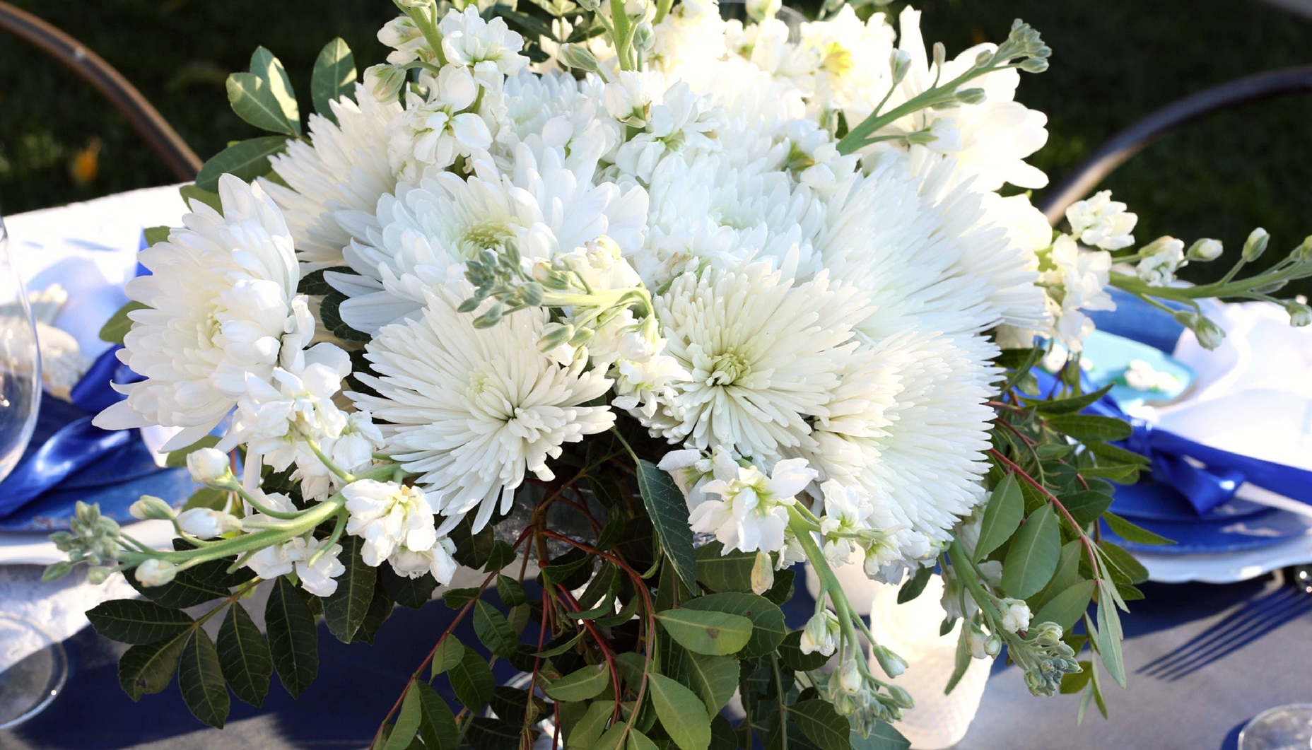 white flowers in diamond cut pedestal vase for a blue bridal shower