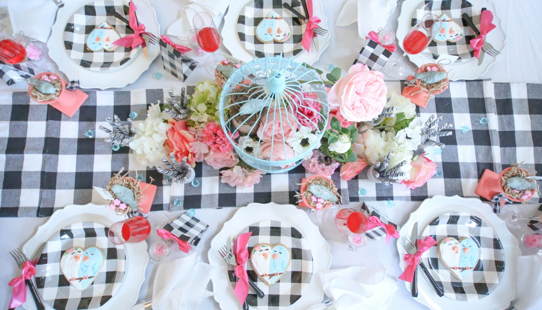 love birds themed shower with buffalo plaid and bird cages