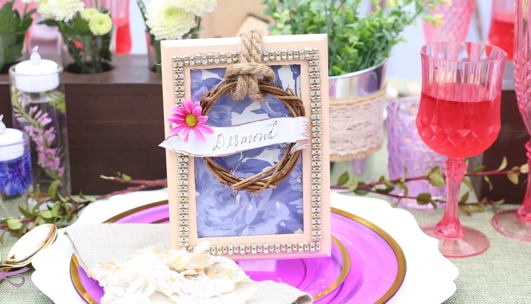 Pale blush wood frame with rhinetone trim, twig wreath and name plate for a floral themed wedding that is full of gorgeous details.