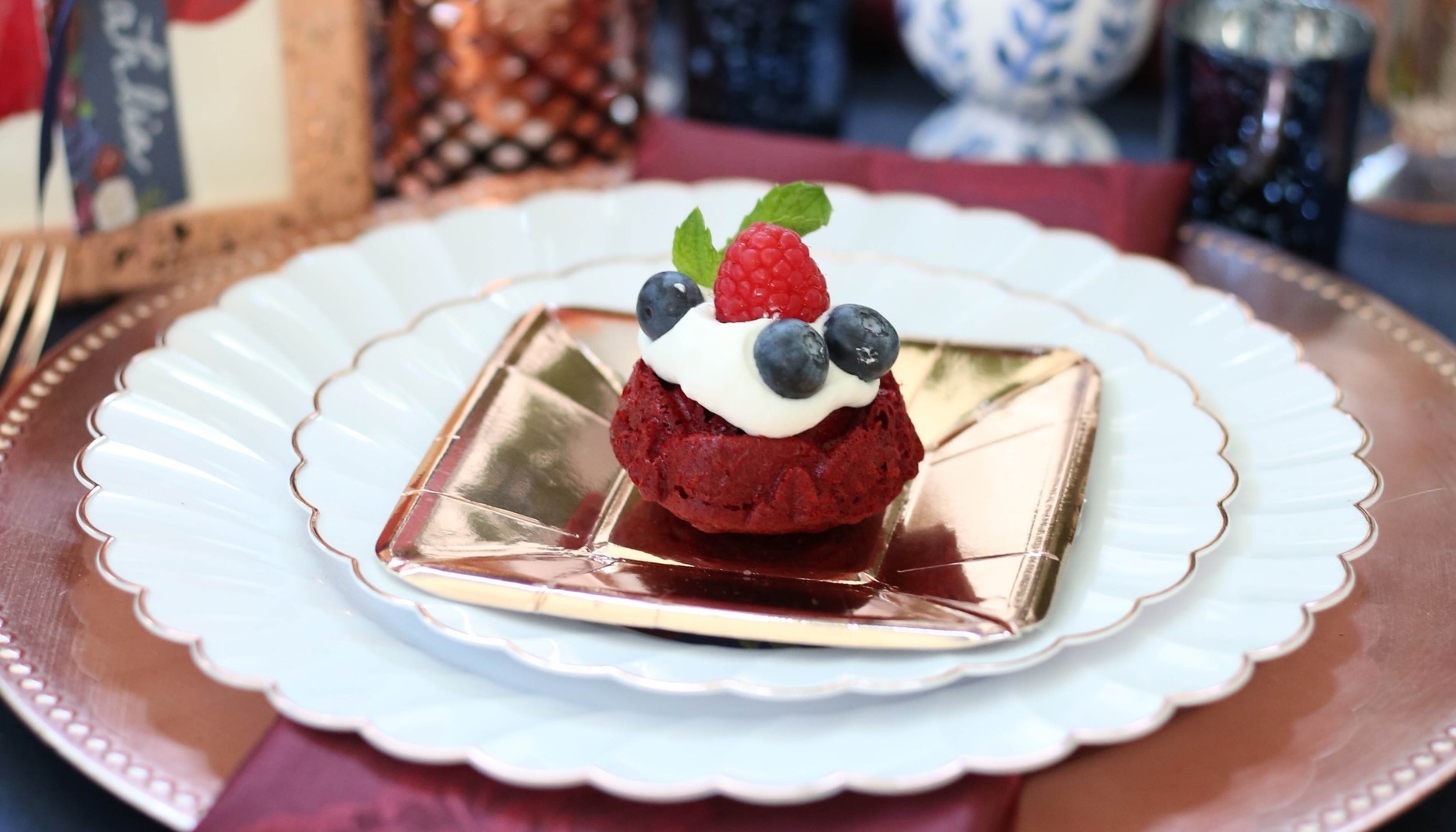 red velvet rose cakes with whipped cream and berries