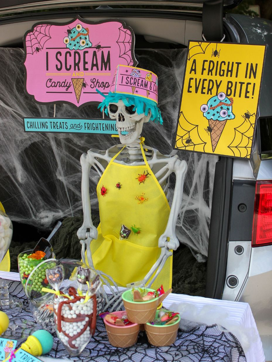 skeleton wearing paper hat with ice cream shop decor signs
