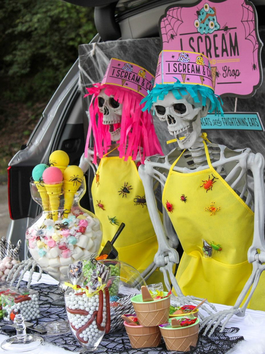 boy and girl skeleton ice cream shop employees