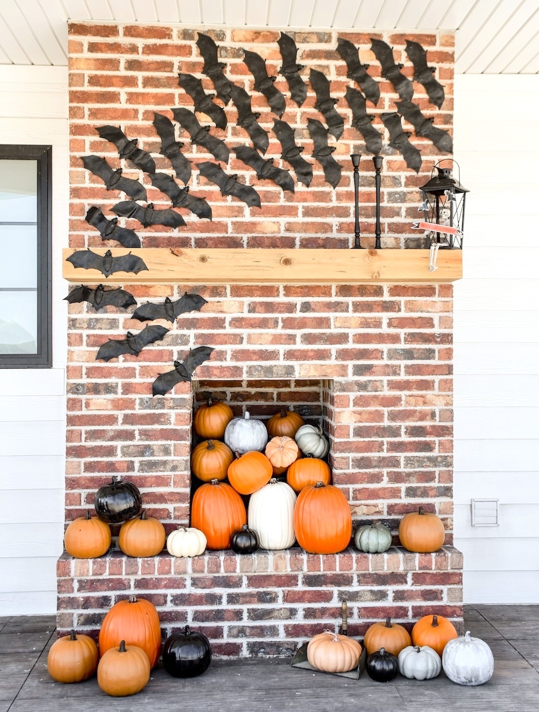 Bat Decor Fireplace Filled with Pumpkins Farmhouse Halloween Front Porch Decorating by Kara's Party Ideas for Oriental Trading Company