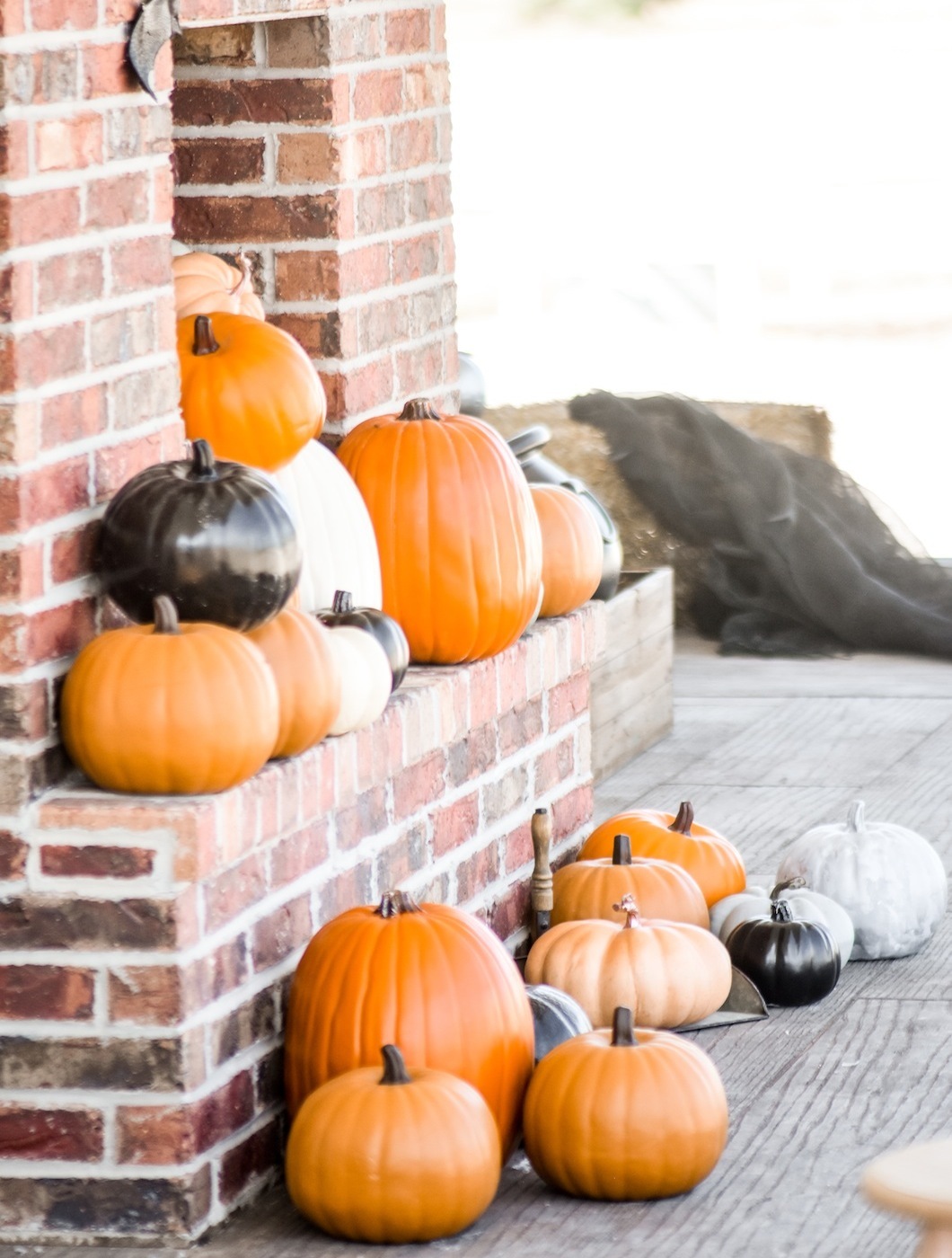 Pumpkins on Fireplace Farmhouse Halloween Front Porch Decorating by Kara's Party Ideas for Oriental Trading Company