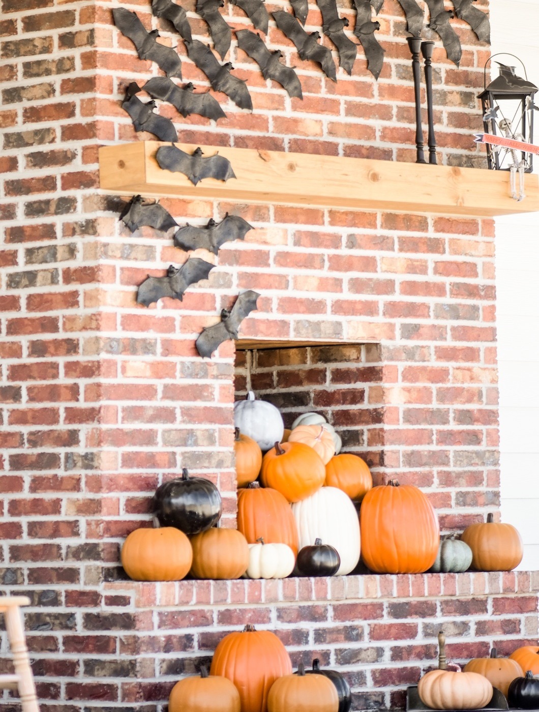 fall farmhouse halloween porch mantel with bats and pumpkins by Kara's Party Ideas for Oriental Trading Company
