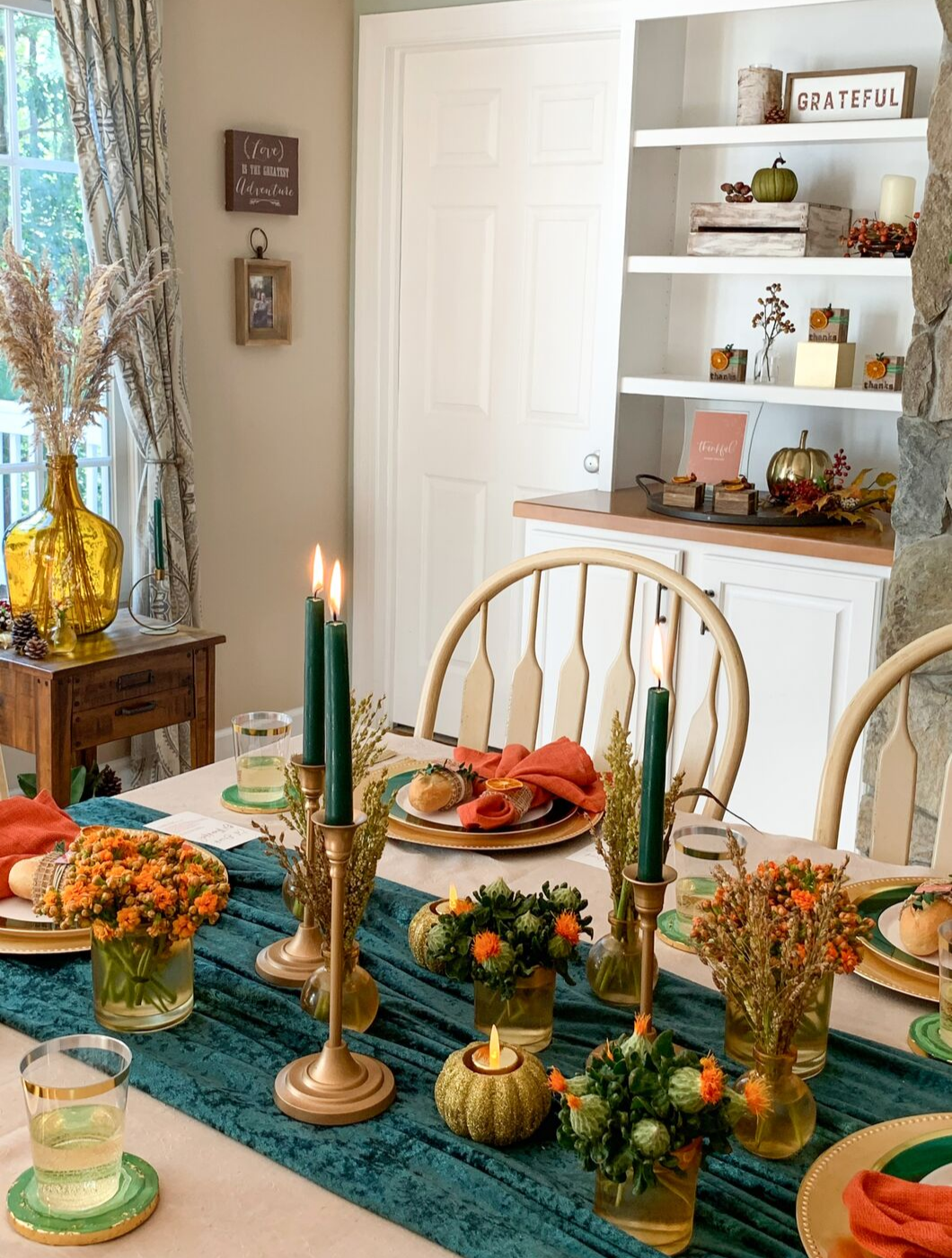 Learn how a simple combination of candles, votives and fresh flowers can create a stunning Thanksgiving centerpiece!