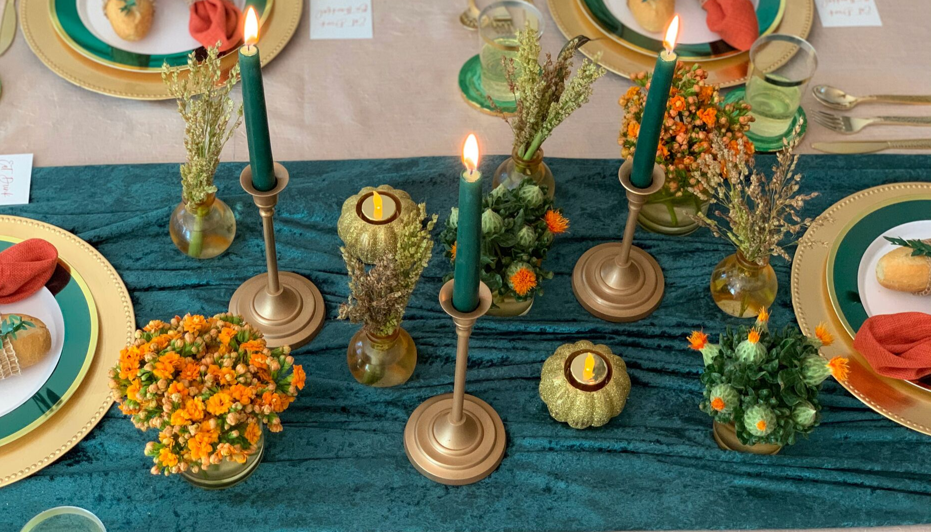 Learn how a simple combination of candles, votives and fresh flowers can create a stunning Thanksgiving centerpiece!