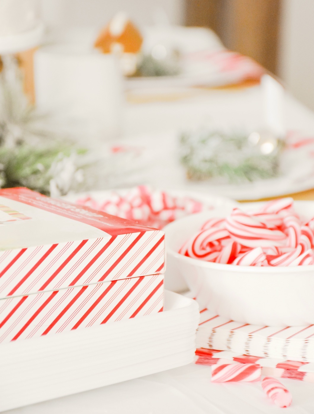 Candy Canes for Decorating Guessing Game at Gingerbread House Holiday Christmas baby shower table and ideas
