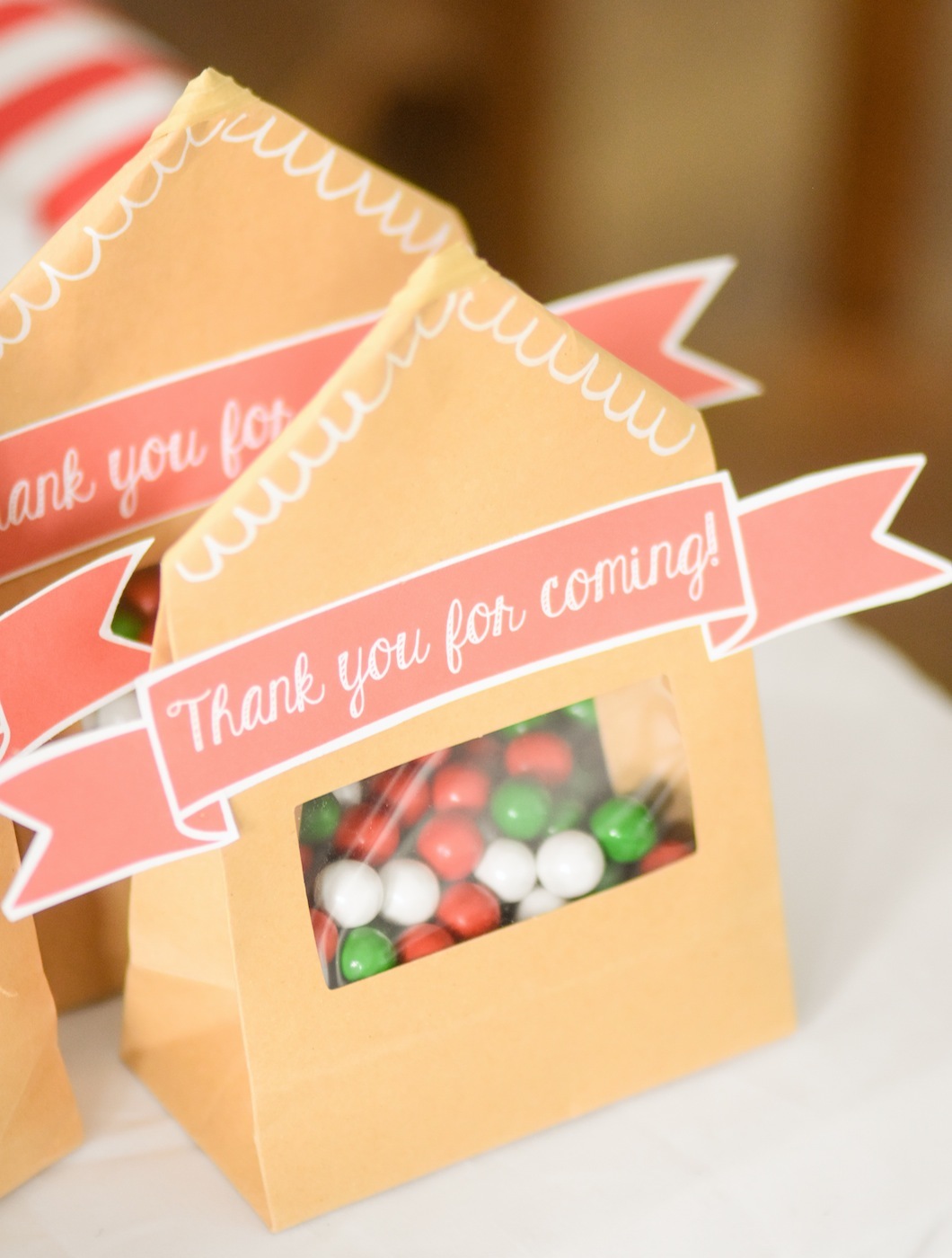 Party Favors Gingerbread House Holiday Christmas baby shower table and ideas