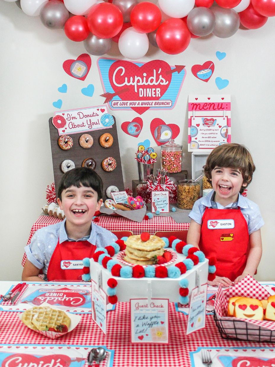 two boys sitting at the table in Cupid's Diner