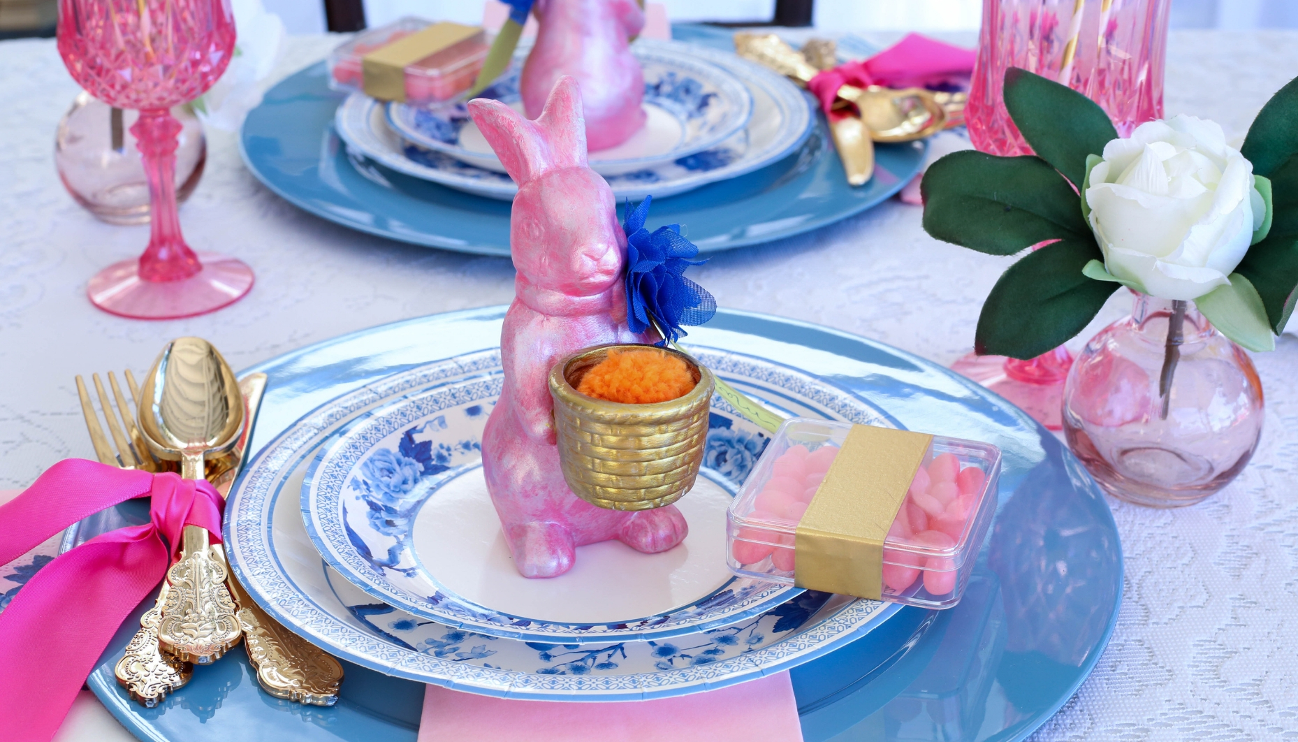 Ceramic bunny place card holders are painted and covered in pearl mod podge for a spring bridal shower