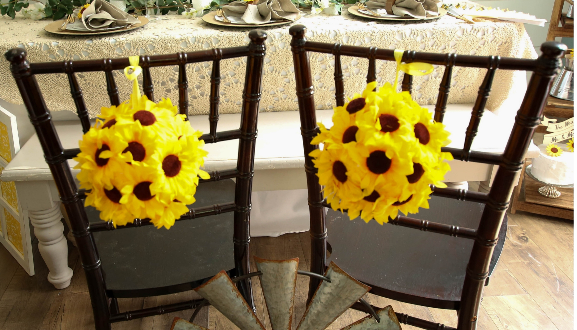 Sweetheart chair decor for a sunflower themed wedding, sunflower kissing balls and a galvanized farmhouse prop