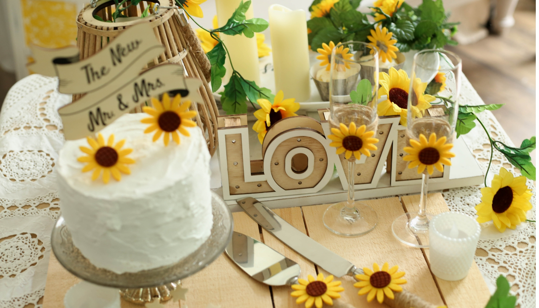 Sunflower themed wedding with DIY toasting flutes and cake set.