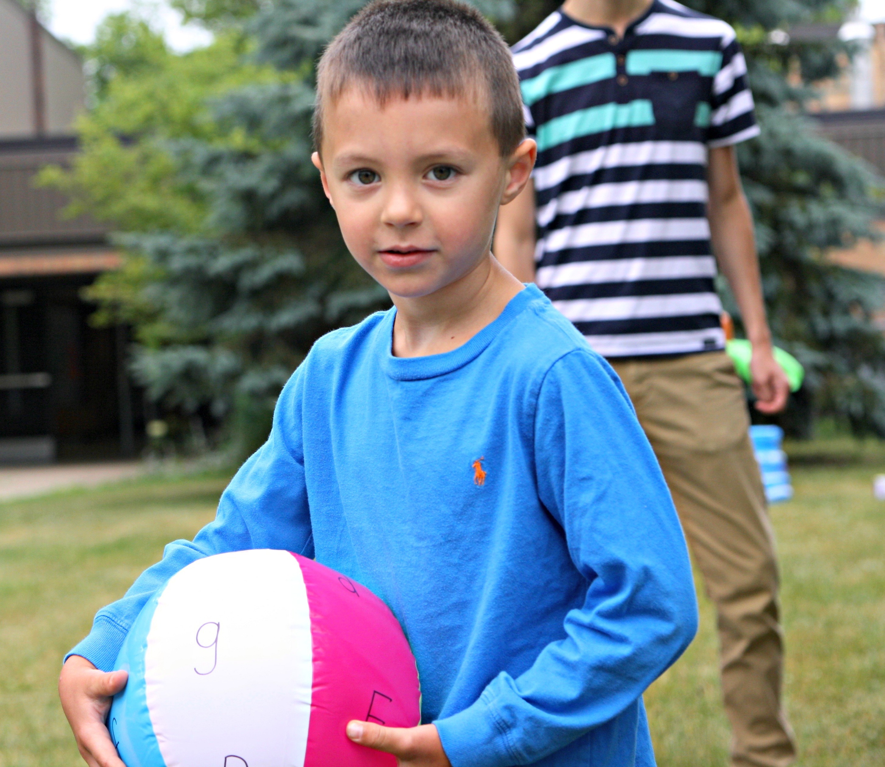 Write uppcase and lowercase letters on a beach ball and toss the beach ball back and forth. Name the letter closest to your thumb!