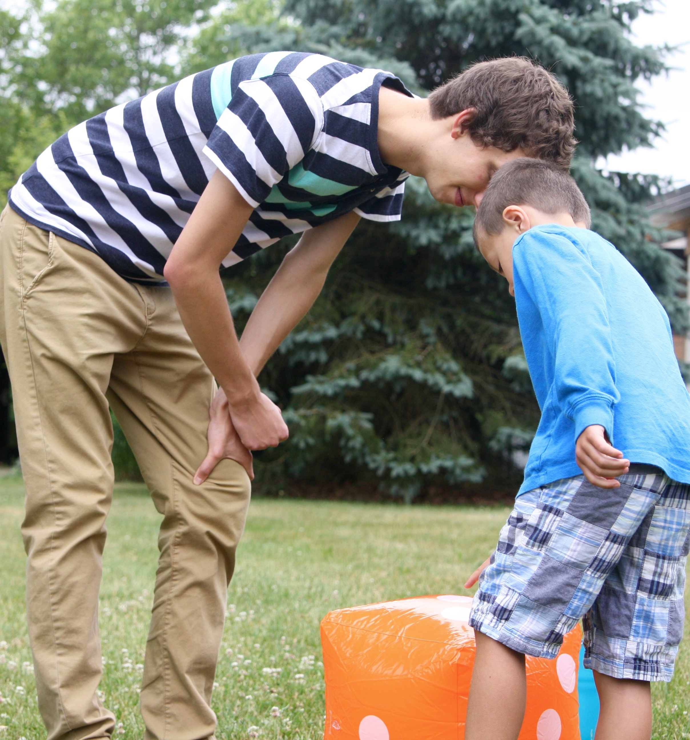 Roll the inflatable dice, count the dots, and jump to that number!