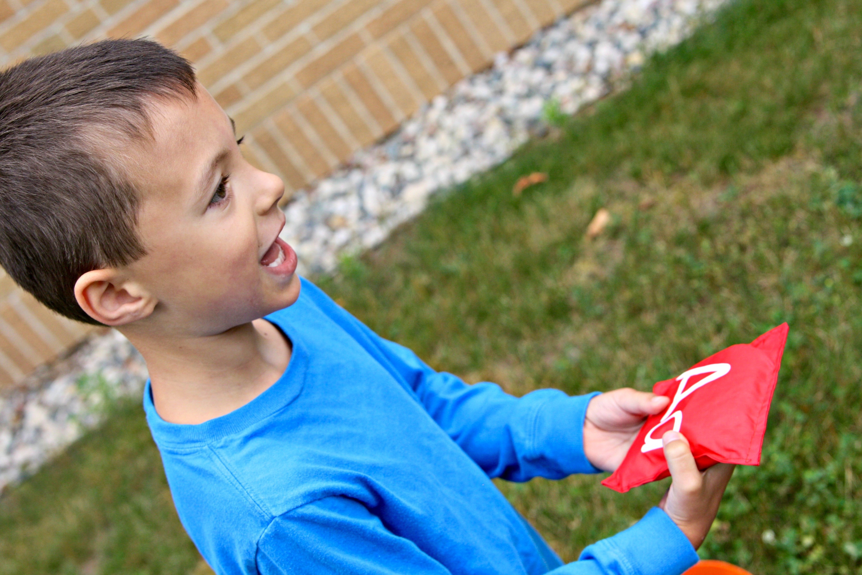 Have your child identify the letter and the sound on each bean bag as they toss it into a series of buckets.
