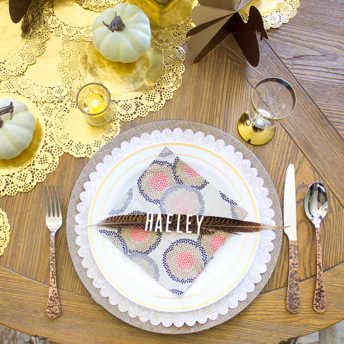 Thanksgiving place setting with pheasant feathers