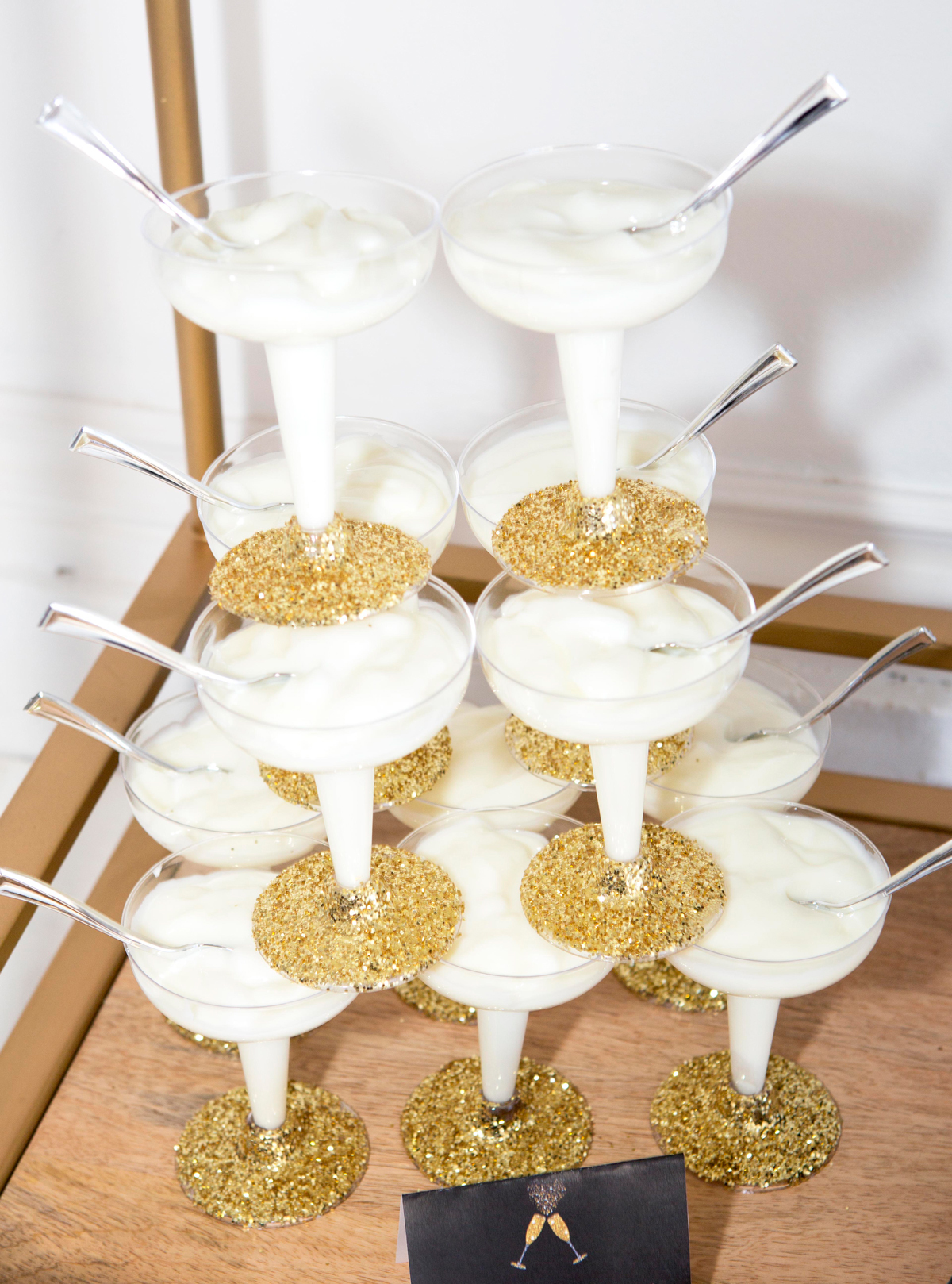 gold glitter dipped champagne glasses and champagne tower