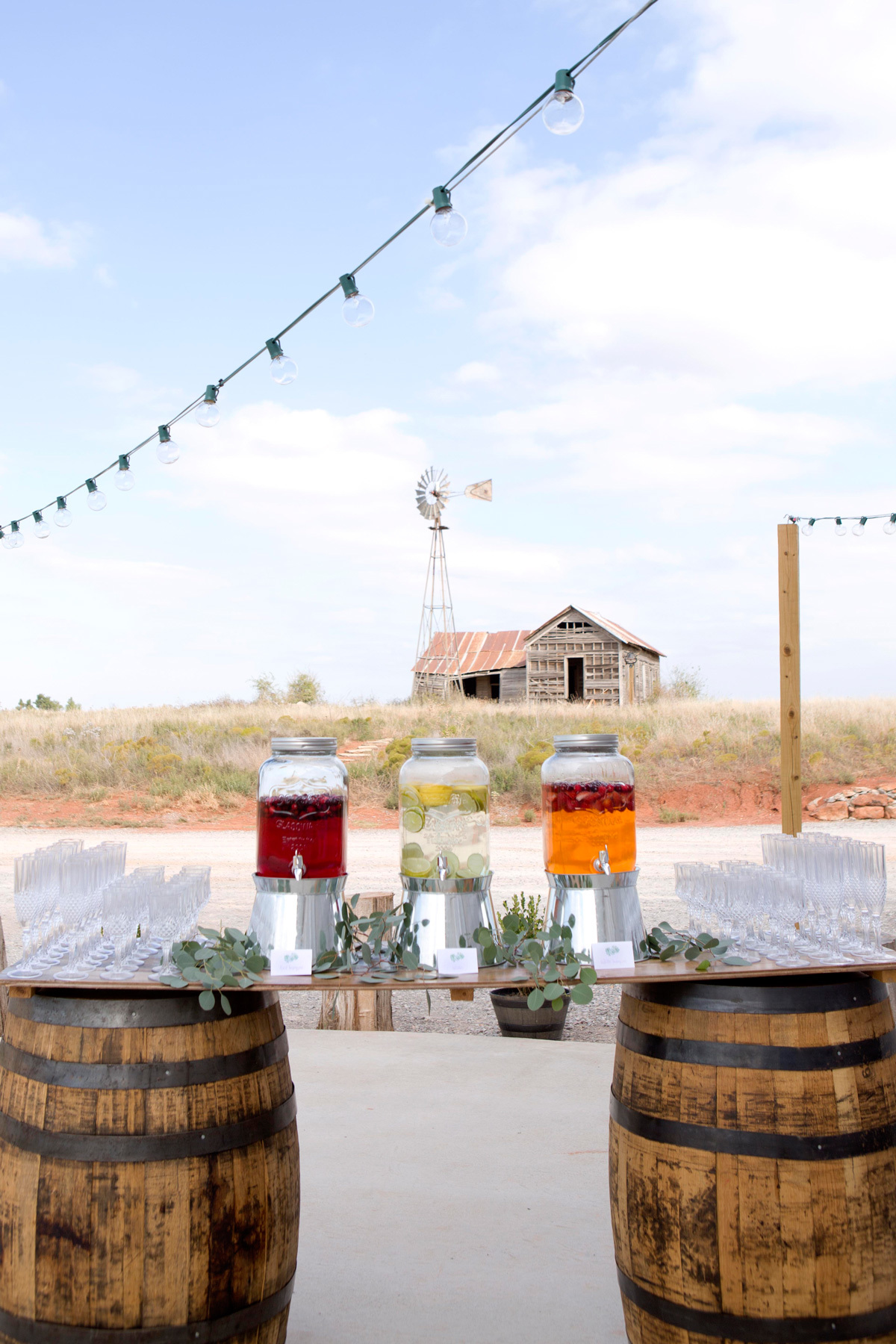 Rustic Barn Wedding Drink Station with whiskey barrels