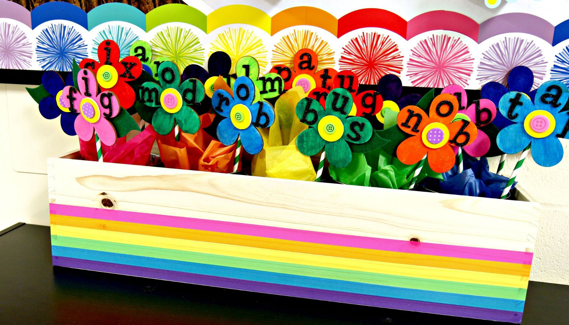 This interactive spring bulletin board is the perfect addition to any classroom. Students will read and sort CVC and CVCe words and place them into the correct vowel bucket.