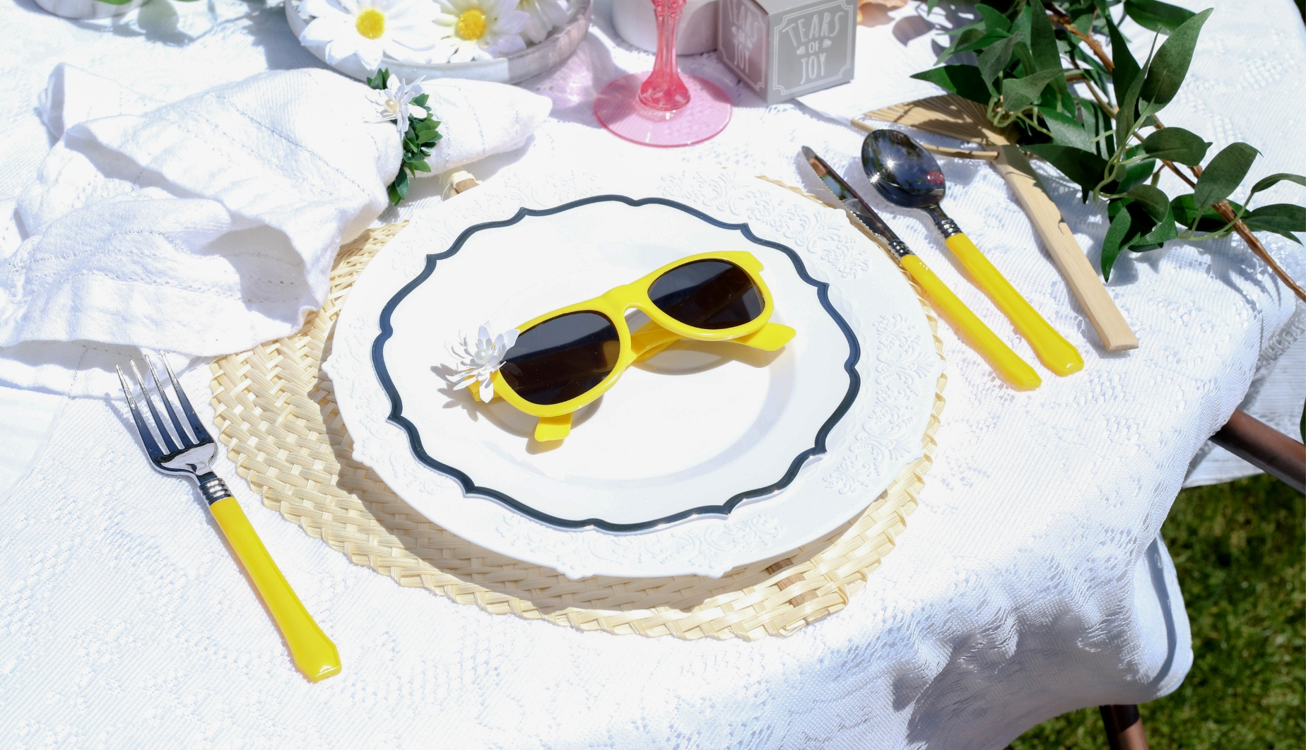 place settings with yellow flatware Place setting boho chic daisy themed wedding