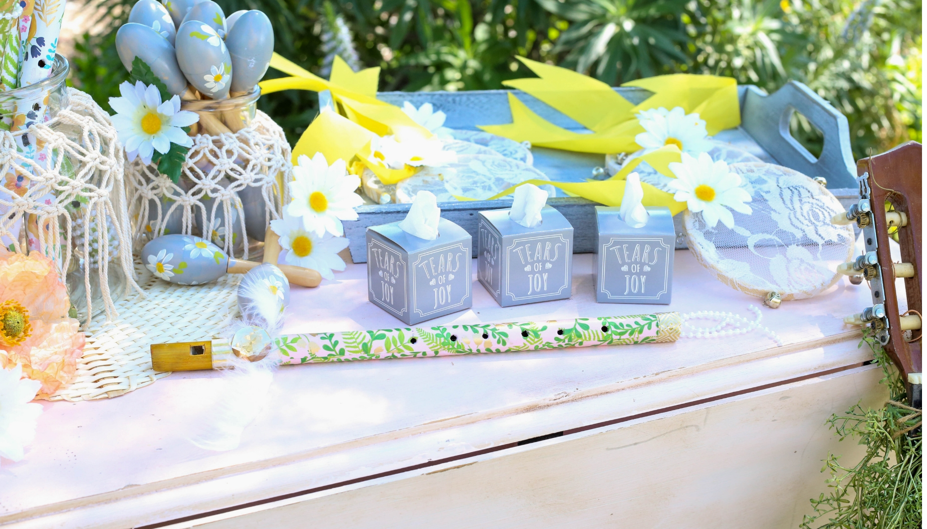 musical sendoff station Musical instruments are decorated to coordinate with a bohemian daisy theme, and are ready for a unique sendoff for the bride and groom.