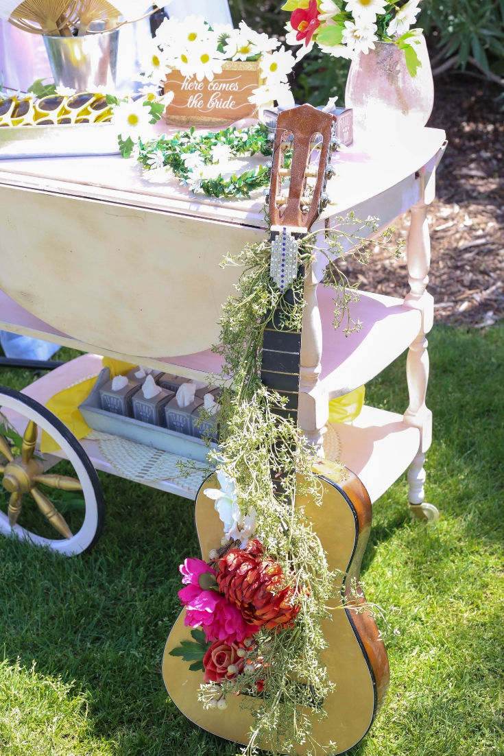 boho chic guitar with florals Draped and floral embellished guitar for a bohemian style wedding