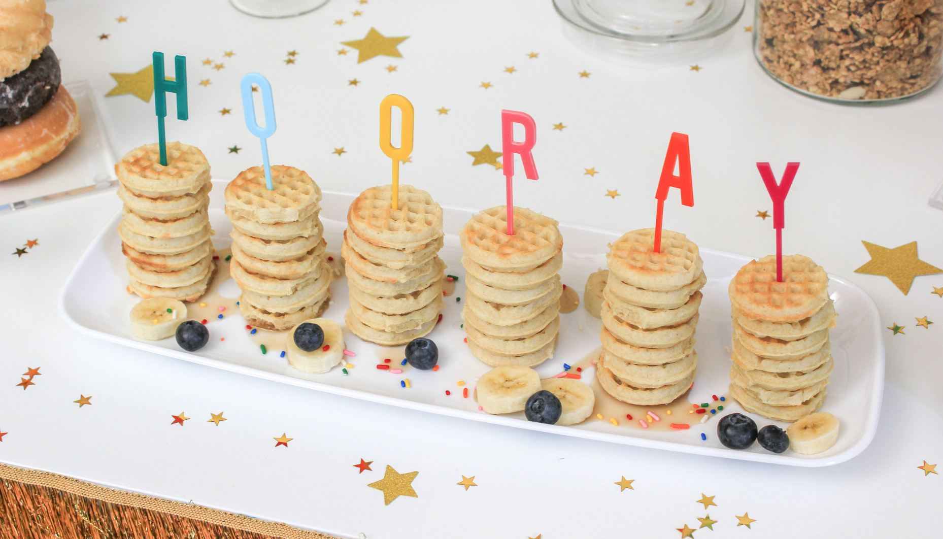 Stacks of mini waffles on a white platter