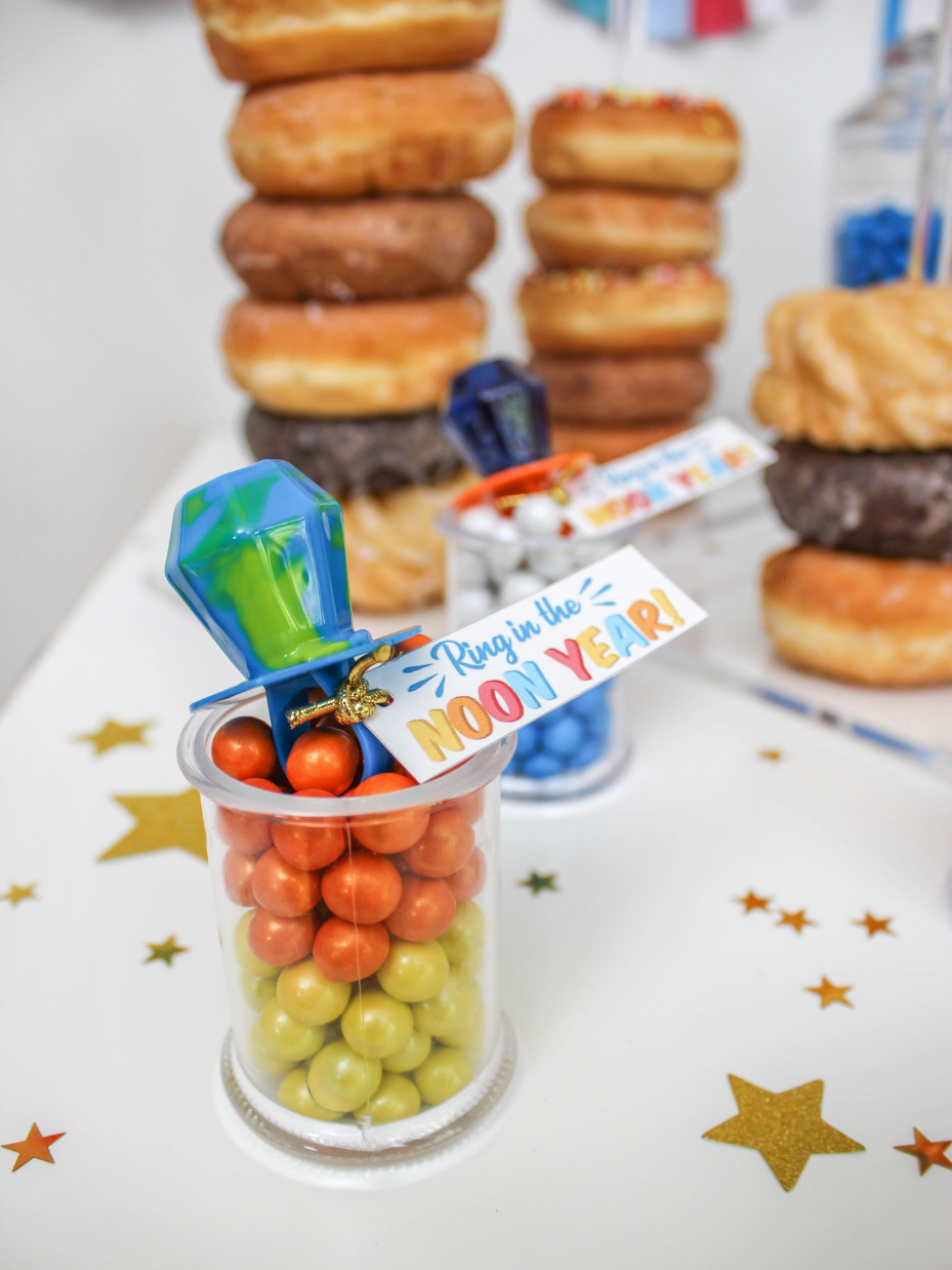 Small container of candies with a Ring Pop on top