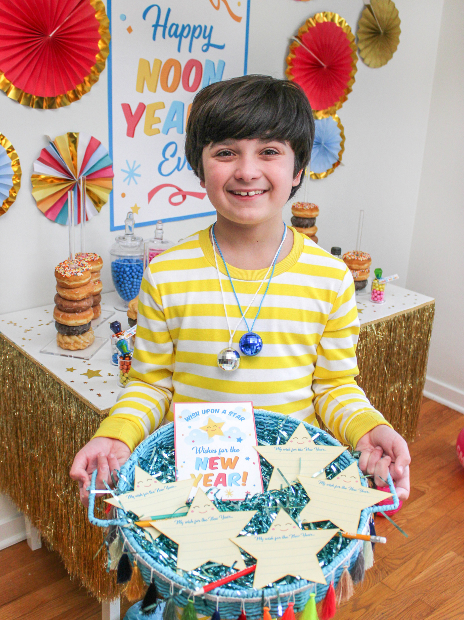 Boy holding Wishes for the New Year activity