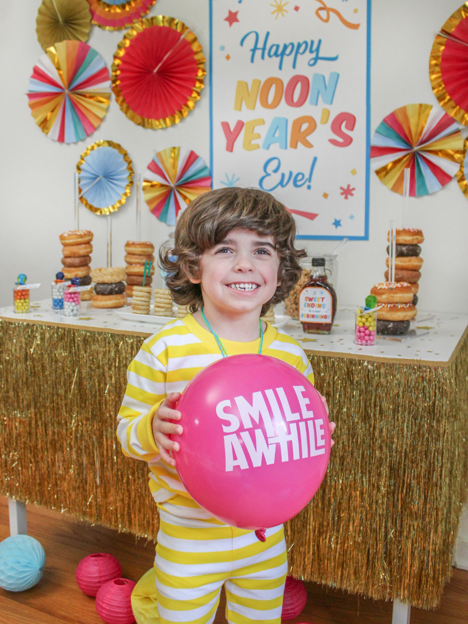 Boy holding a balloon