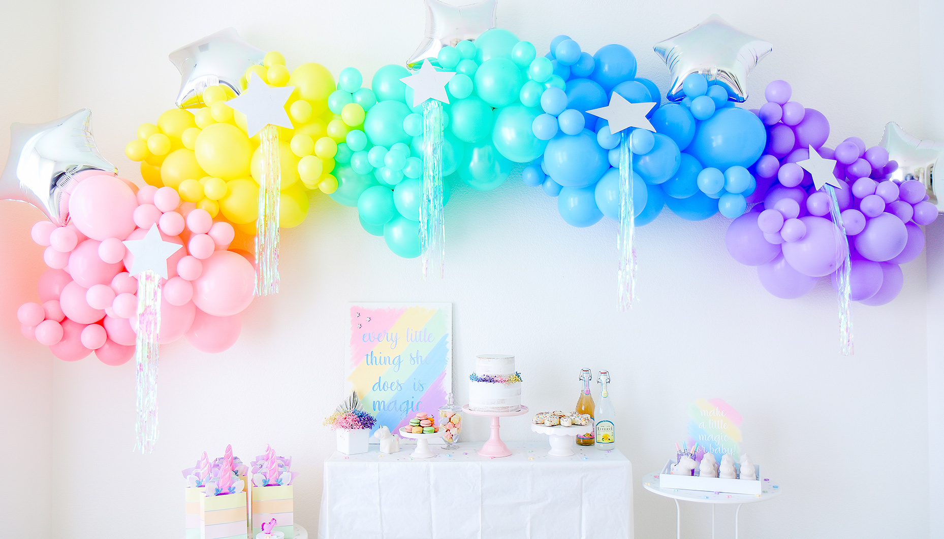 rainbow unicorn sip & see dessert table