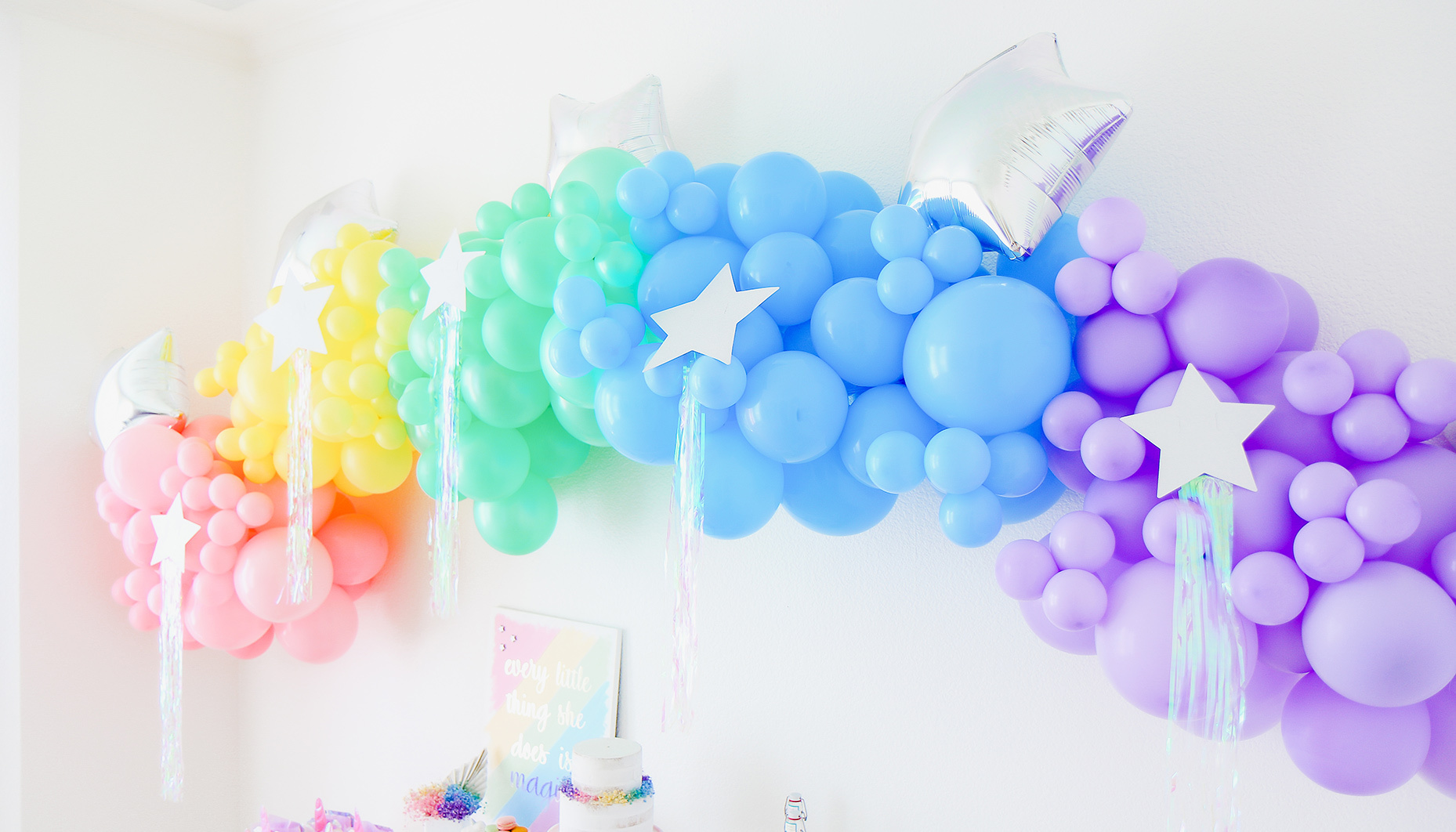 pastel rainbow balloon arch