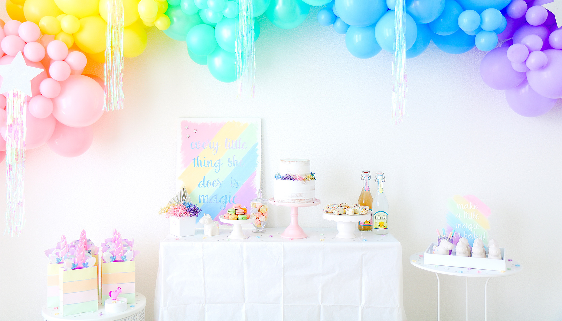 rainbow unicorn sip & see dessert table