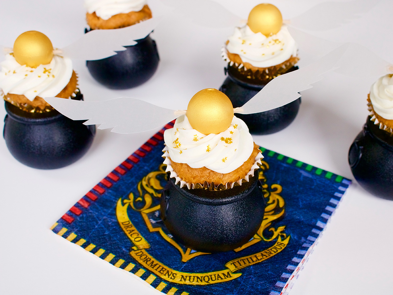 Golden Snitch Topped Butterbeer Cupcakes | Fun365