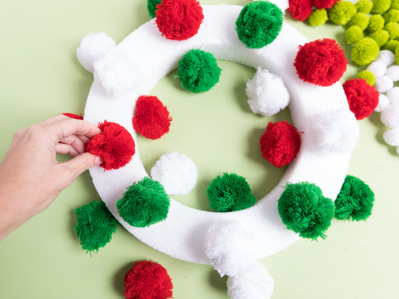 DIY Yarn Christmas Pom Pom Wreath - That Craft Site - fun and easy