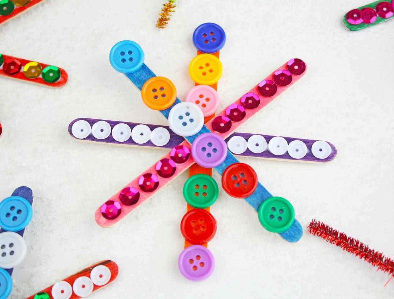 How to Make Colorful Popsicle Stick Snowflakes with Kids - Fun-A-Day!